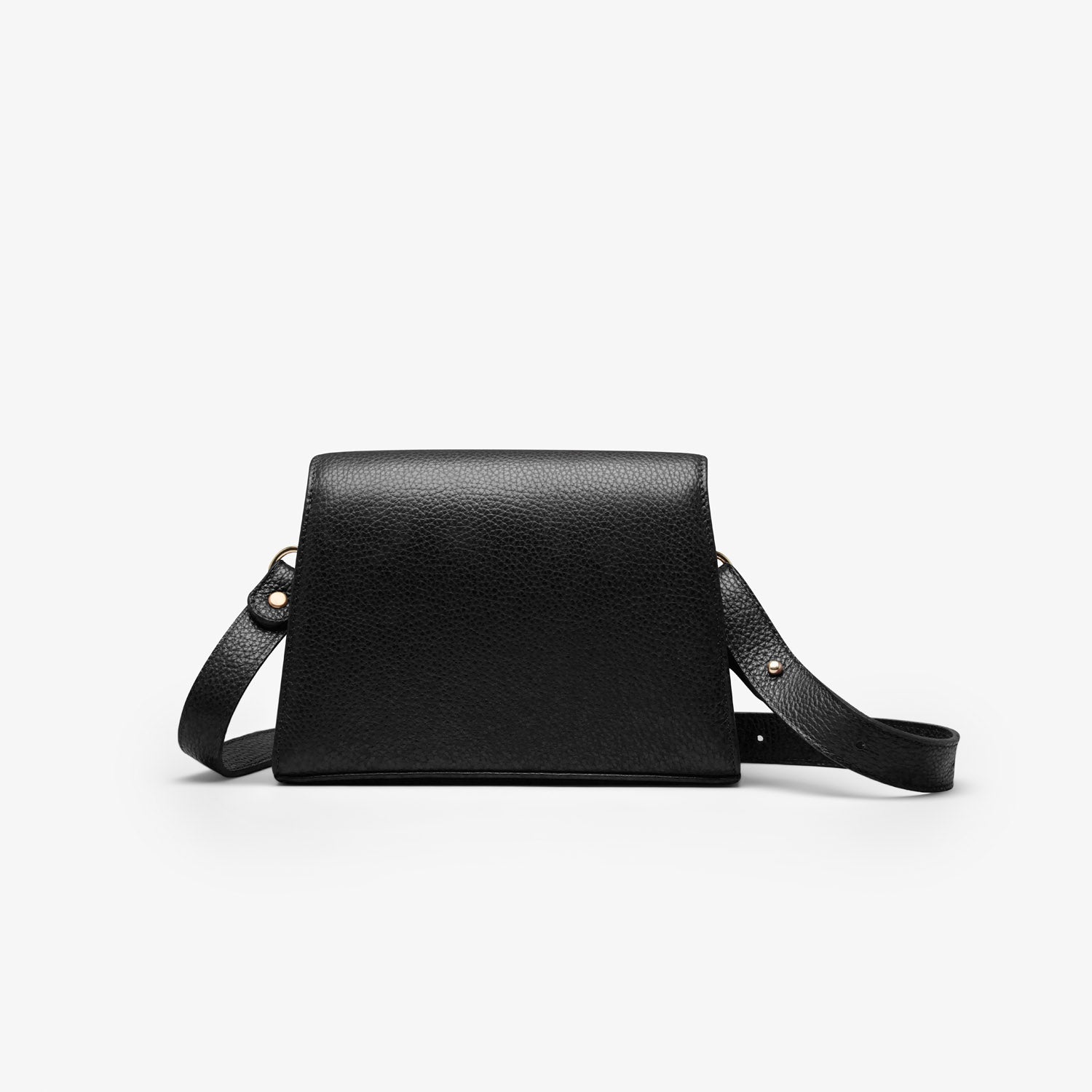 Shows the backside of a black grained leather handbag with light gold metalware and an adjustable strap for a comfortable crossbody or shoulder fit. 