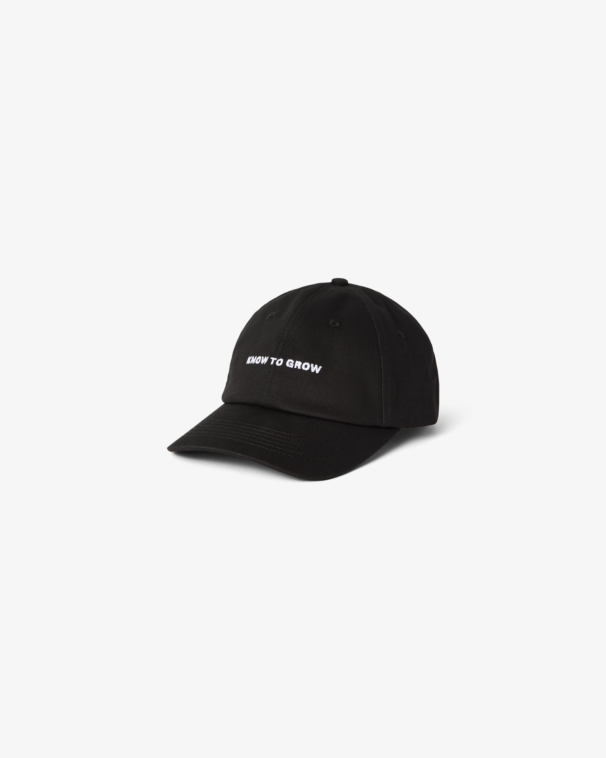 A black cotton cap with the text "KNOW TO GROW" embroidered, shown against a white background.