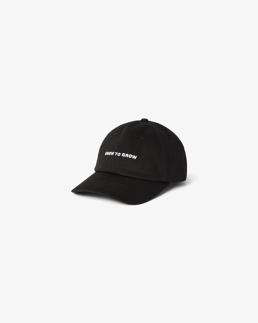 A black cotton cap with the text "KNOW TO GROW" embroidered, shown against a white background.