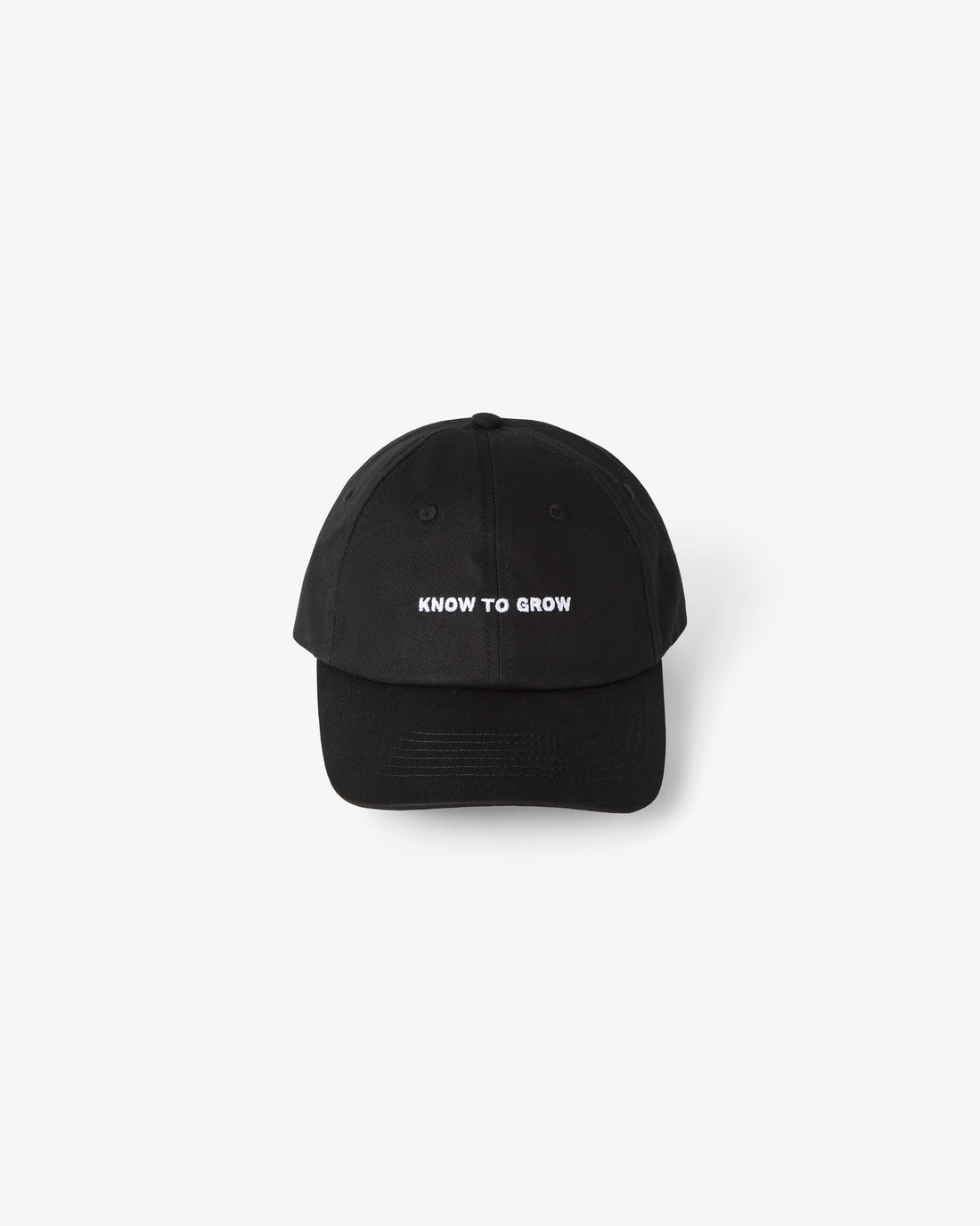 A black baseball cap with the phrase 'KNOW TO GROW' printed in white capital letters on the front, centered against a light gray background.