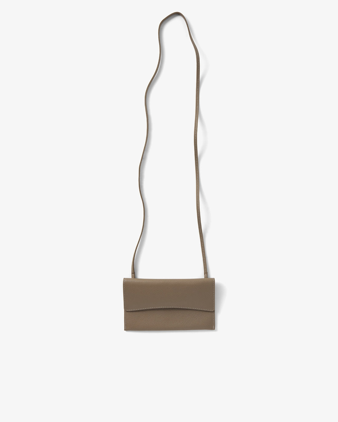 A taupe leather crossbody bag with a long, thin strap, shown against a plain off-white background.