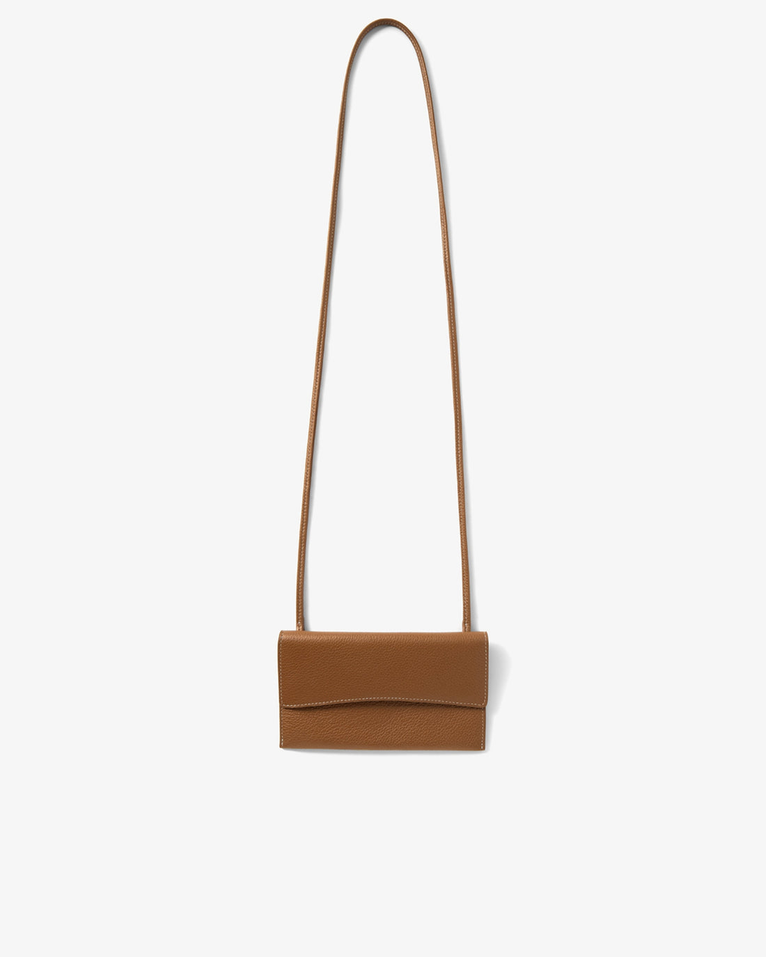 A small tan leather crossbody bag with a long thin strap, shown against a plain light gray background.