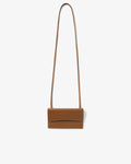 A small tan leather crossbody bag with a long thin strap, shown against a plain light gray background.