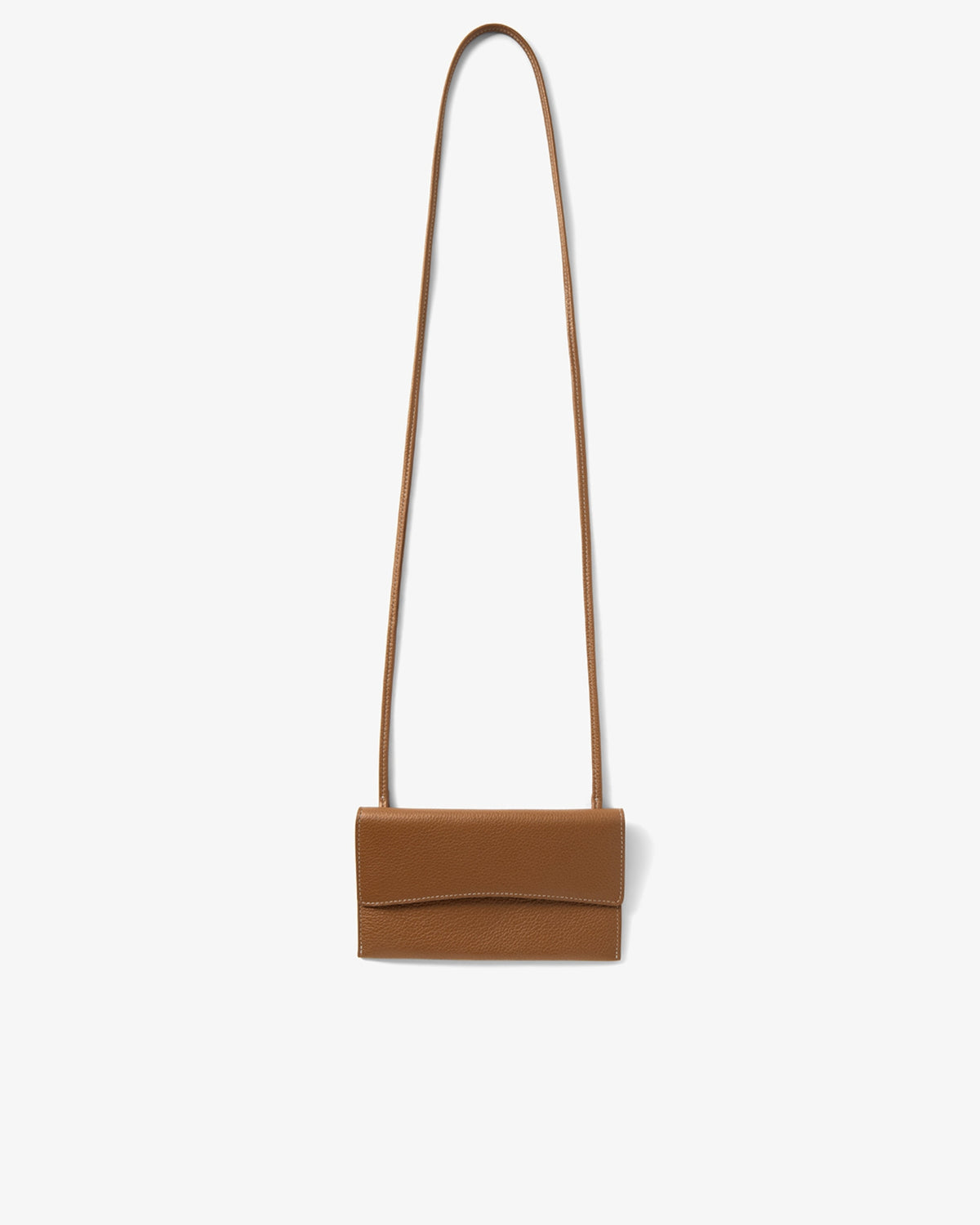 A small tan leather crossbody bag with a long thin strap, shown against a plain light gray background.