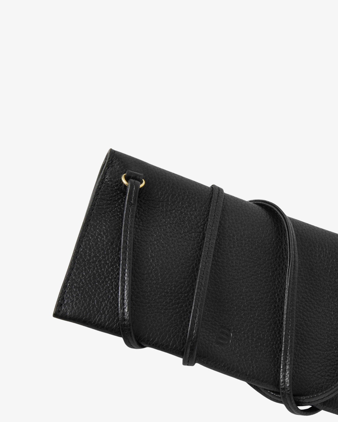 Close-up of a black pebbled leather clutch bag with a strap and gold-tone ring detail, shown against a plain white background.