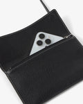 A black pebbled leather clutch shown open, with a silver smartphone partially tucked into the zip pocket. The product is photographed on a clean white background.