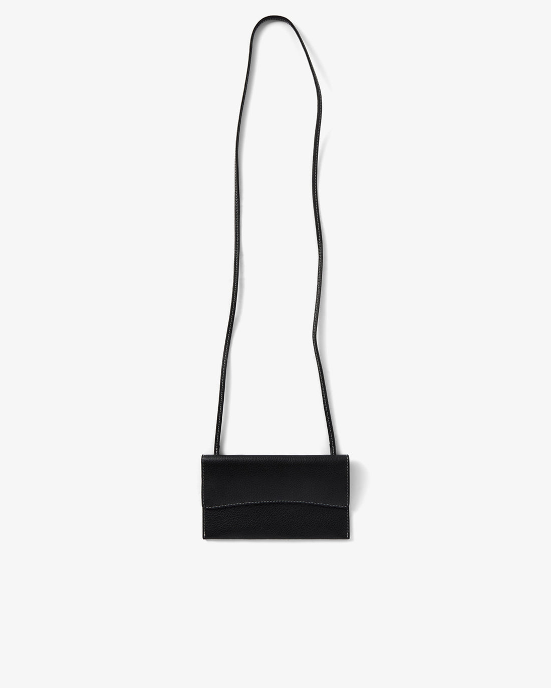 A minimalist black leather crossbody bag with a long, thin strap and a structured rectangular body, shown against a plain light gray background.