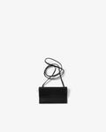 A small black leather crossbody bag with a long thin strap, photographed flat against a light gray background.