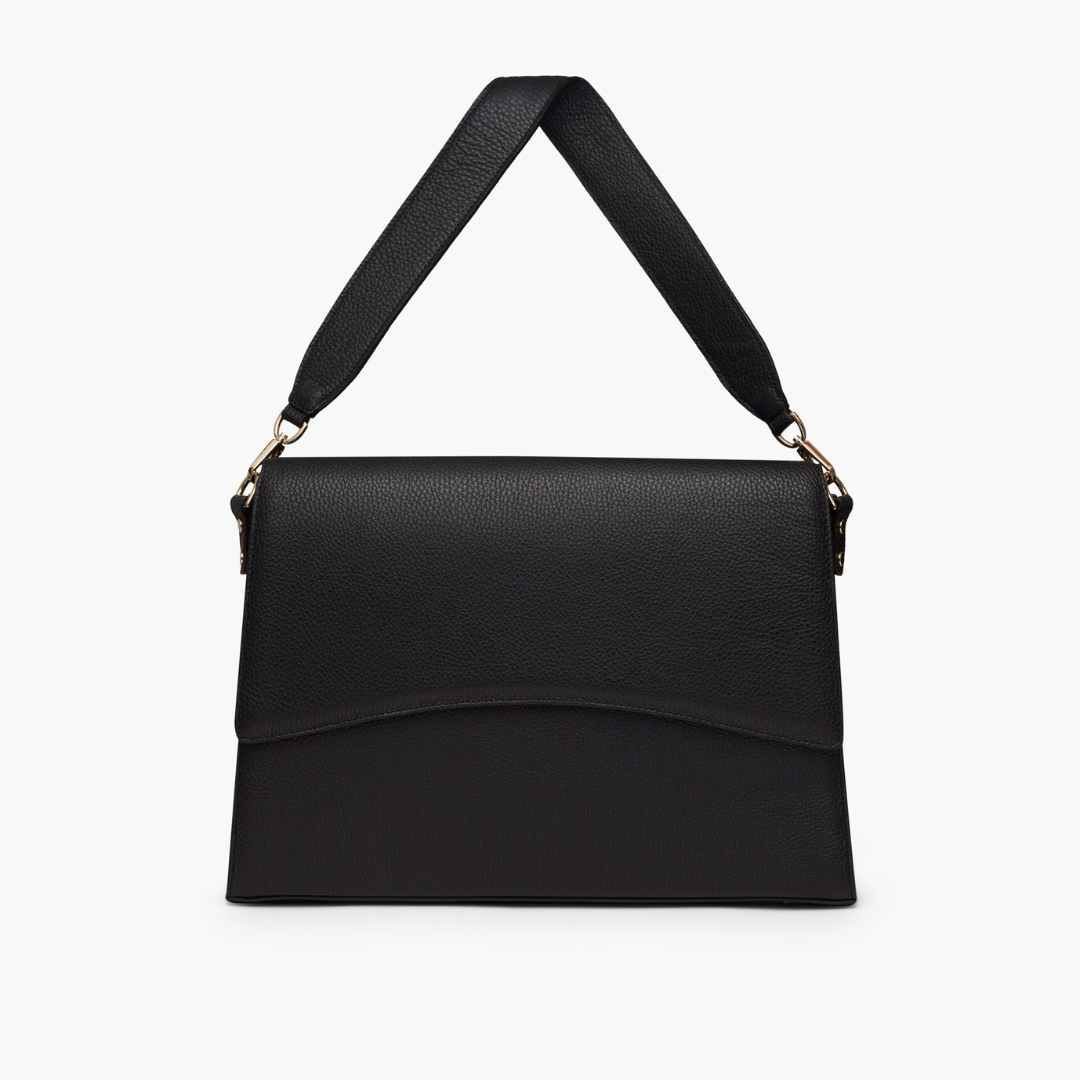 A black laptop bag with grained leather and light gold metalware. It has a detachable shoulder strap. 