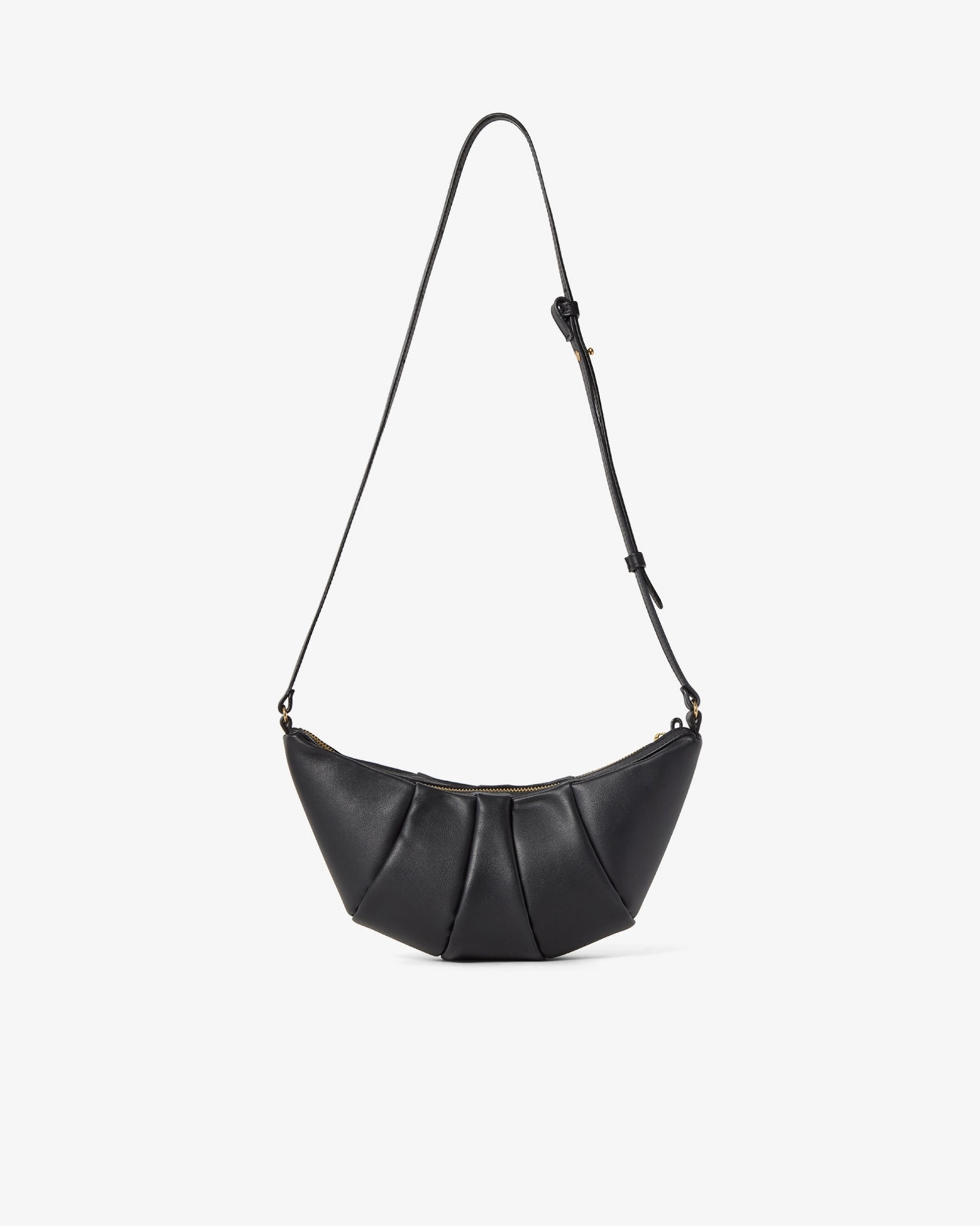 A black leather crescent-shaped shoulder bag with a long thin strap, featuring a gathered pleated front design, shown against a plain light gray background.