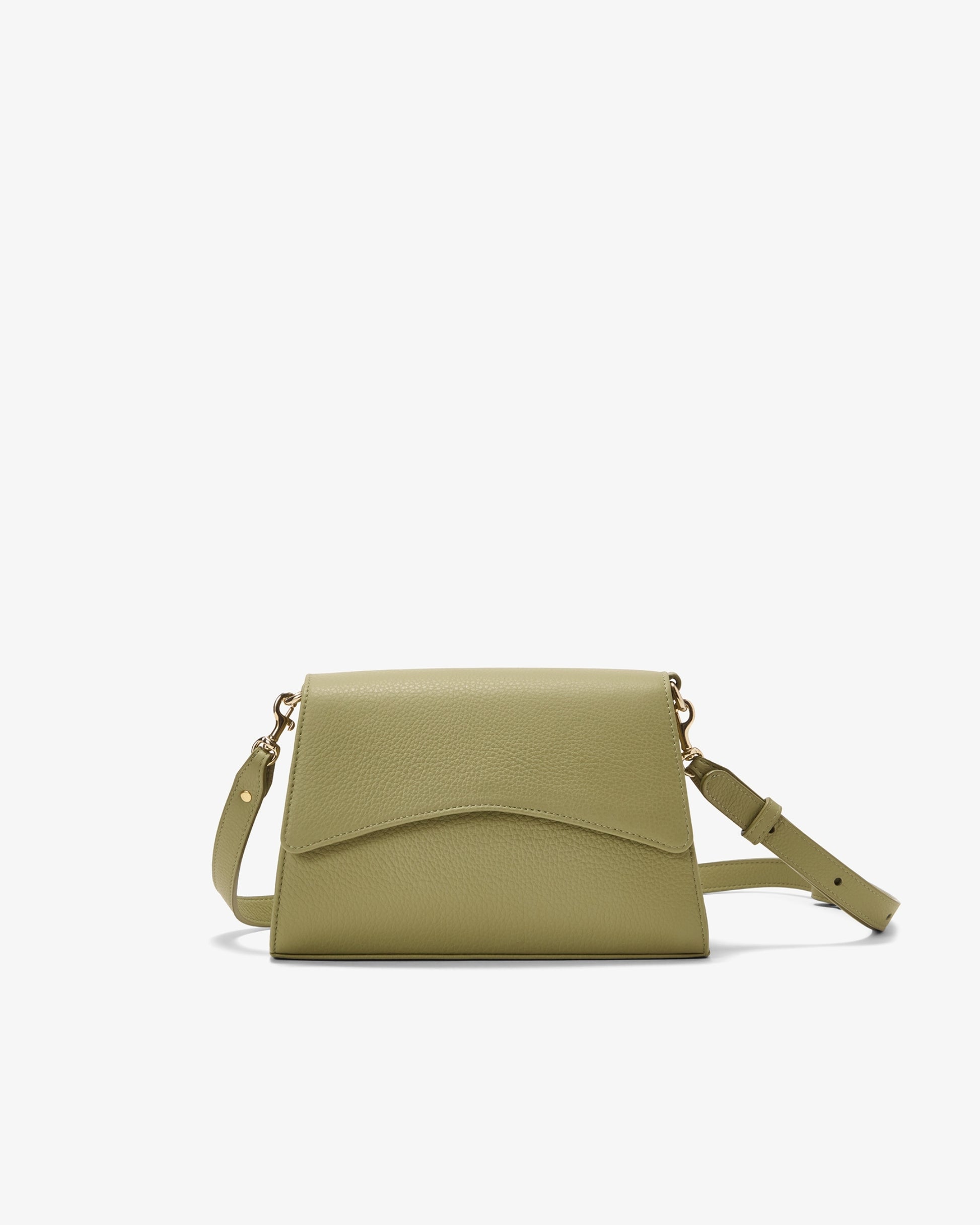 A light olive green leather crossbody bag with a curved flap and a matching shoulder strap, shown against a plain white background.