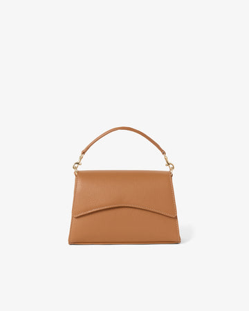 A tan leather handbag with a top handle and gold-tone hardware, shown against a plain white background.