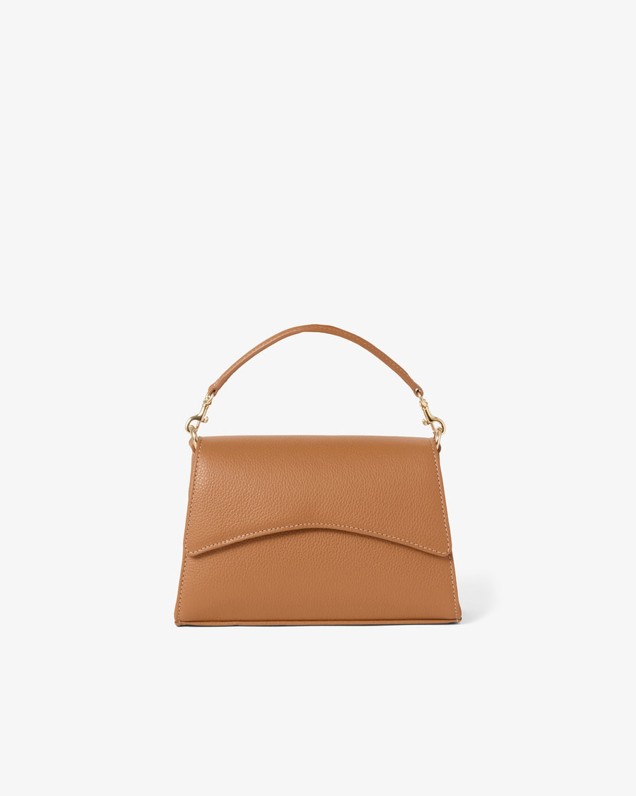 A tan leather handbag with a top handle and gold-tone hardware, shown against a plain white background.
