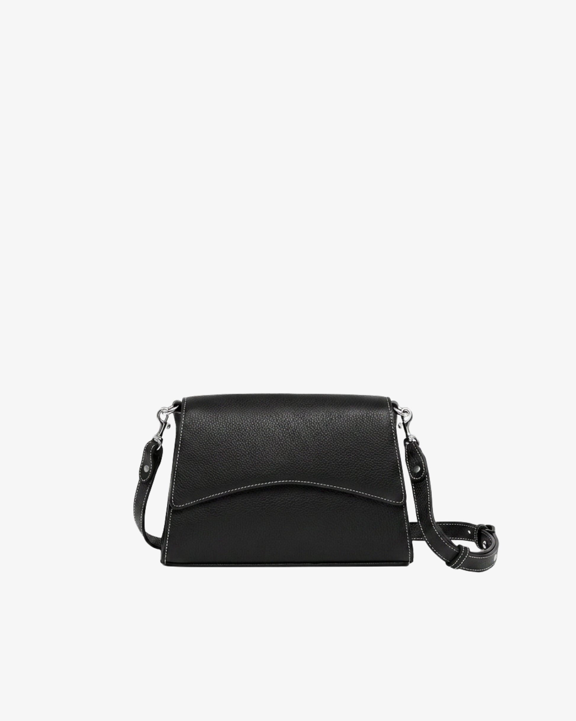 A black pebbled leather crossbody handbag with contrast stitching and silver hardware, with a curved front flap and a matching adjustable shoulder strap, shown against a plain white background.