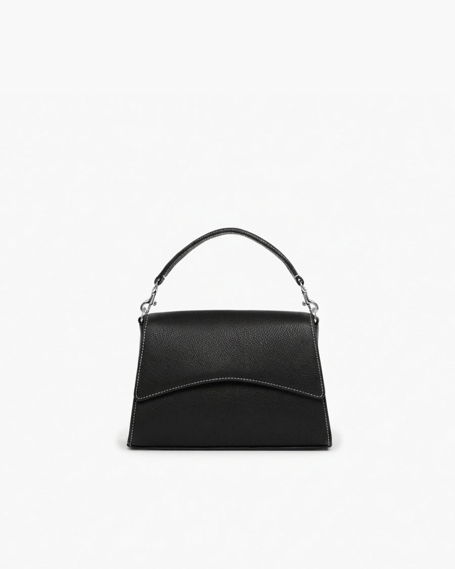A black pebbled leather handbag with contrast stitching, silver hardware and a structured top handle, shown against a plain white background.