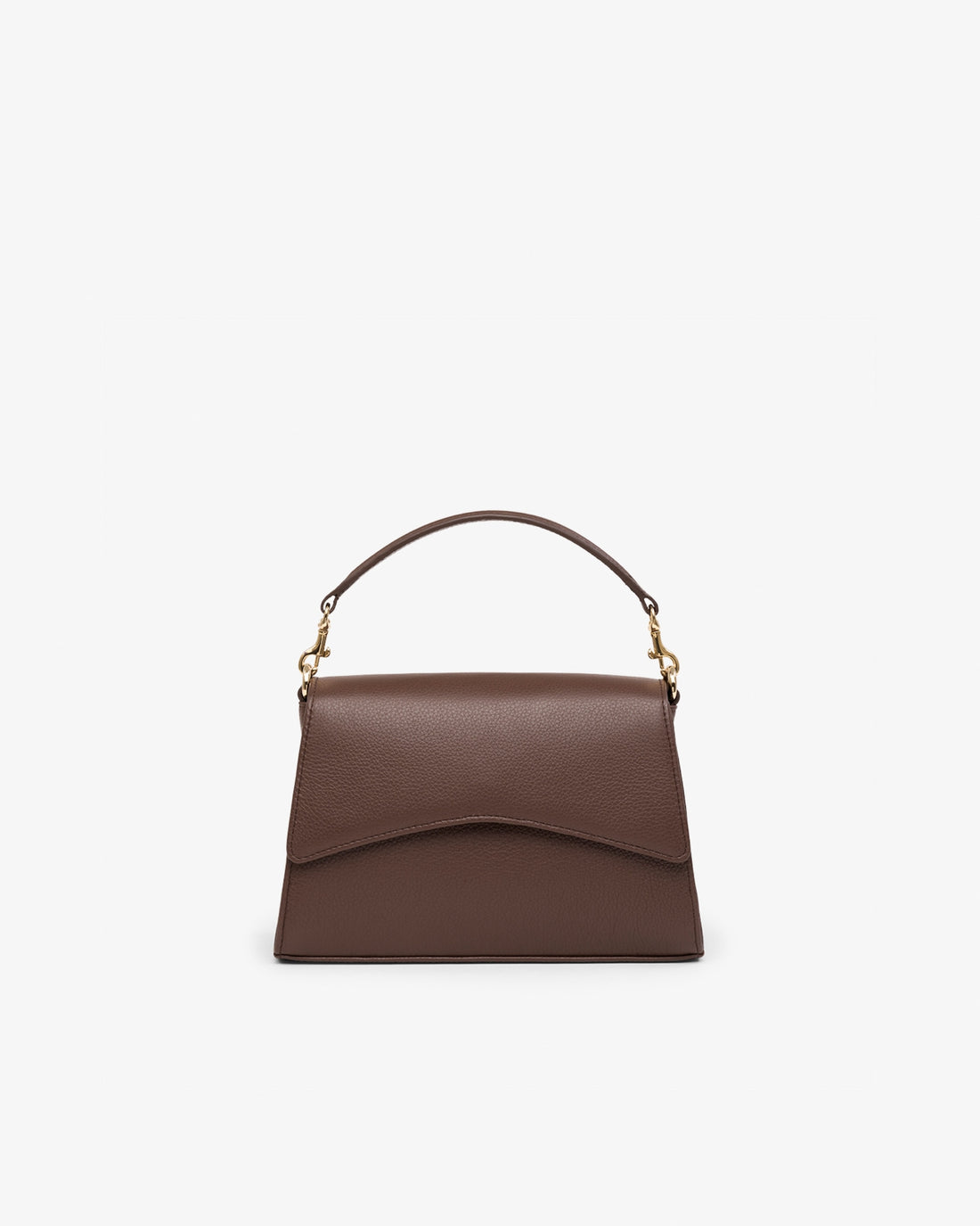 A brown leather top-handle handbag with a curved flap front and gold-tone hardware, centered on a plain light gray background.