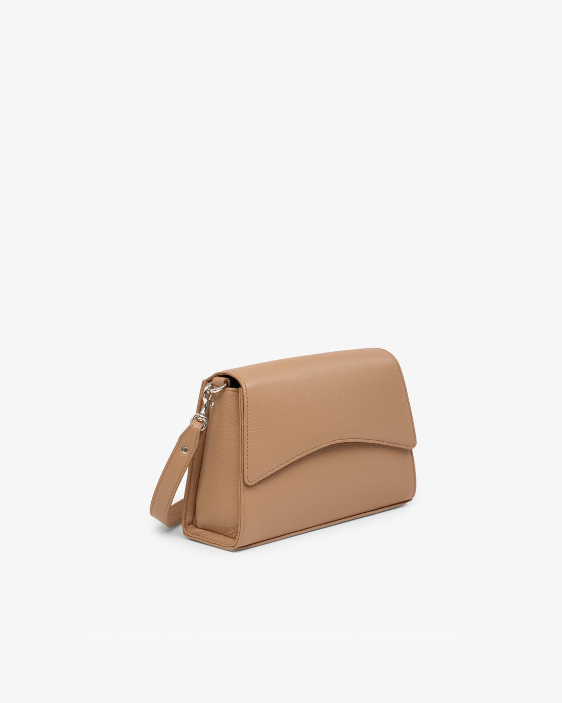 A tan leather crossbody handbag with a curved flap and a matching shoulder strap, shown from a three-quarters angle on a clean white background.