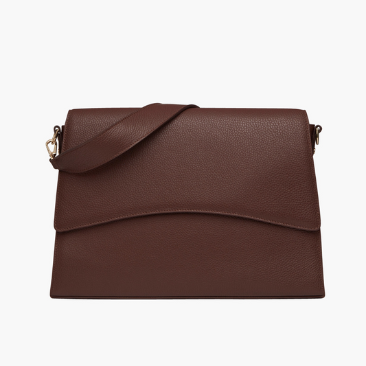 A dark brown laptop bag with grained leather and light gold metalware. It has a detachable shoulder strap. 