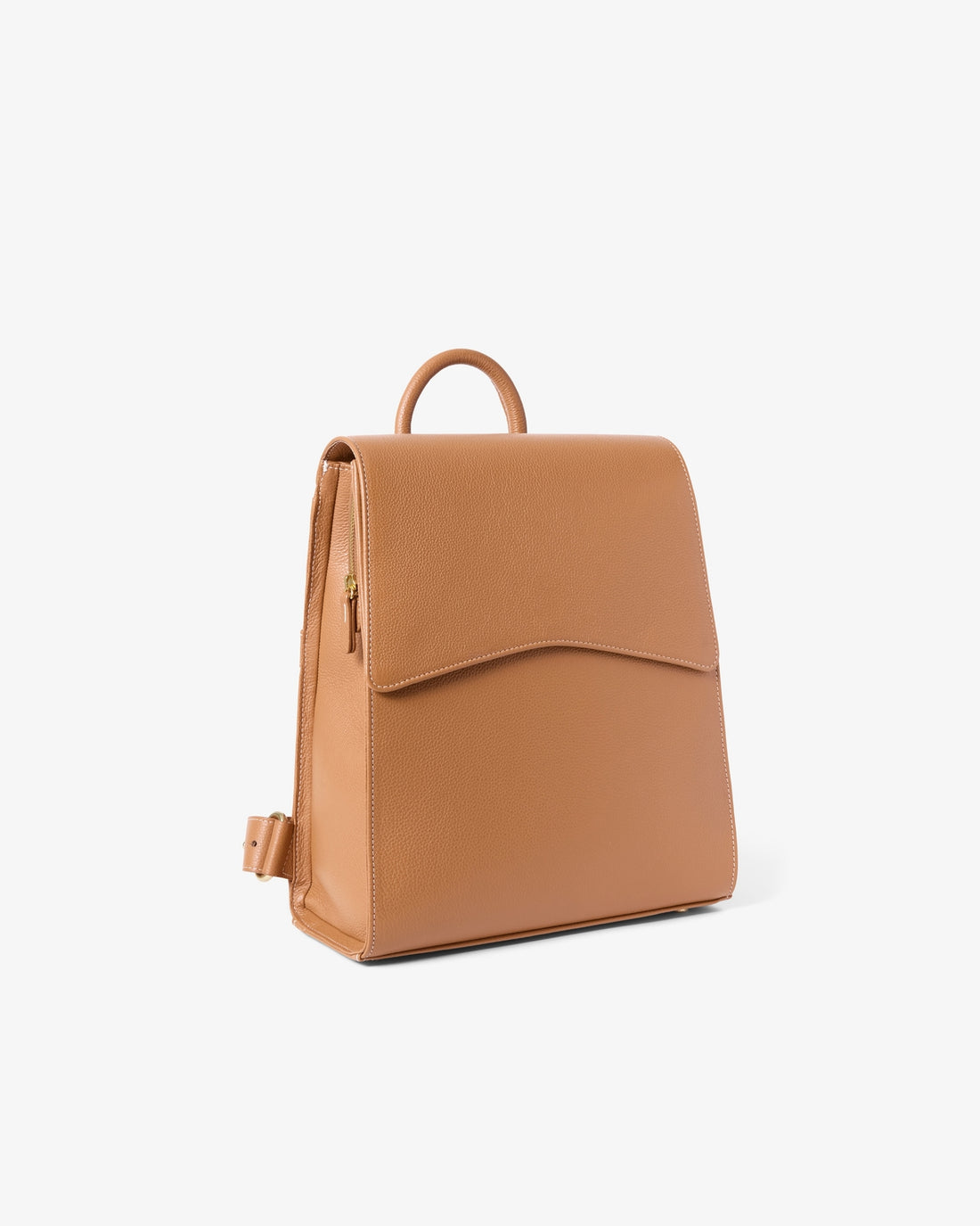 A tan leather backpack with a top handle and a front flap pocket, shown from a three-quarter angle on a light gray background.