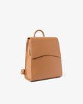 A tan leather backpack with a top handle and a front flap pocket, shown from a three-quarter angle on a light gray background.