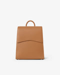 A tan leather backpack with a top handle, shown from the front against a plain white background.