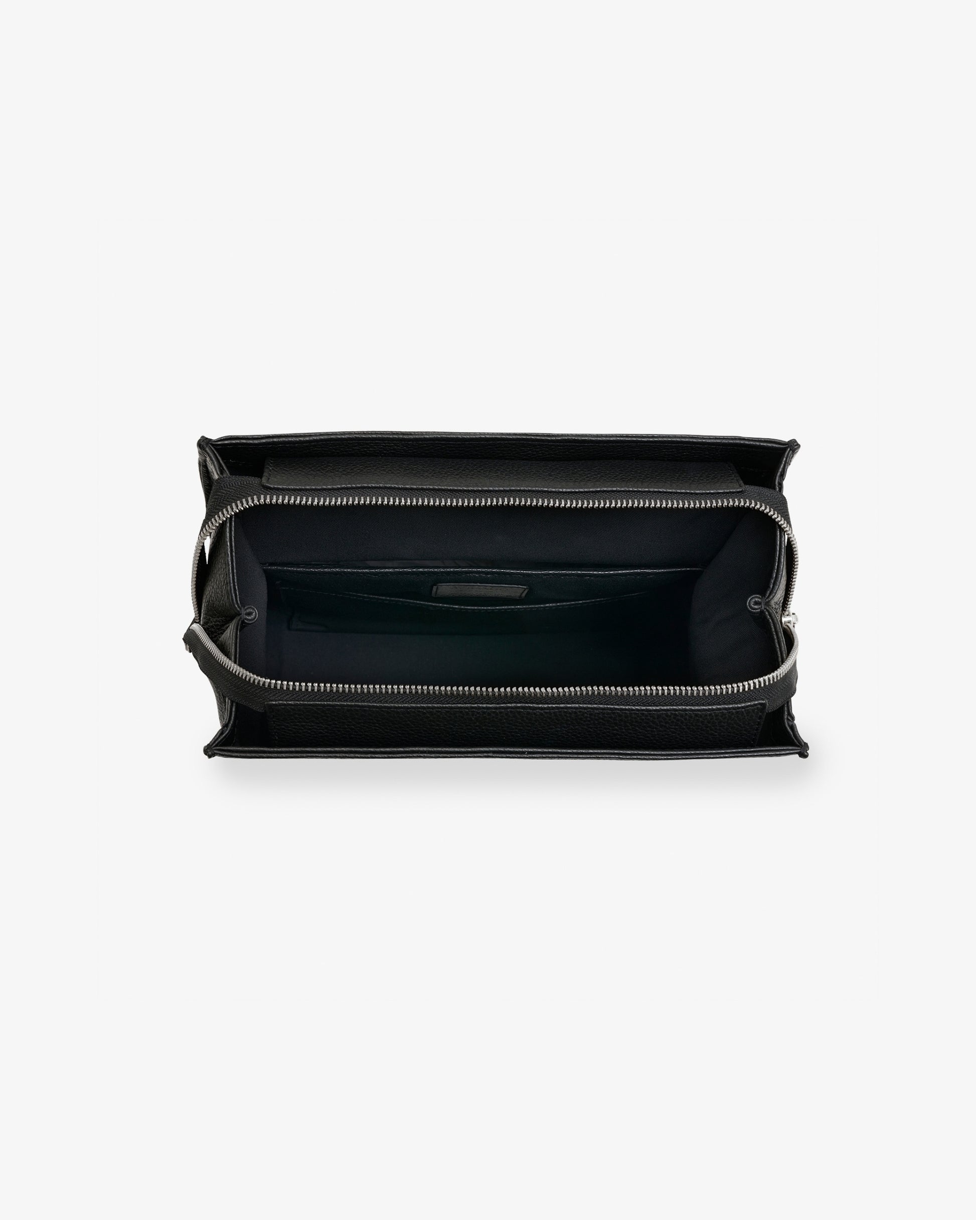 An empty black leather backpack, revealing the black interior lining and inner pockets.