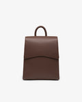 A brown textured leather backpack with a top handle, shown against a plain white background.