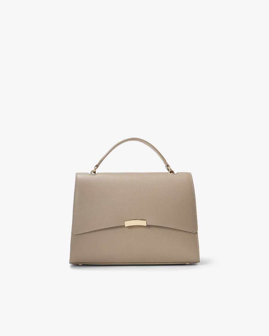 A structured top-handle handbag in light taupe leather with a gold-tone metal clasp and handle hardware, shown against a plain white background.