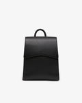 A minimalist black leather backpack with a top handle, shown from the front against a clean white background.