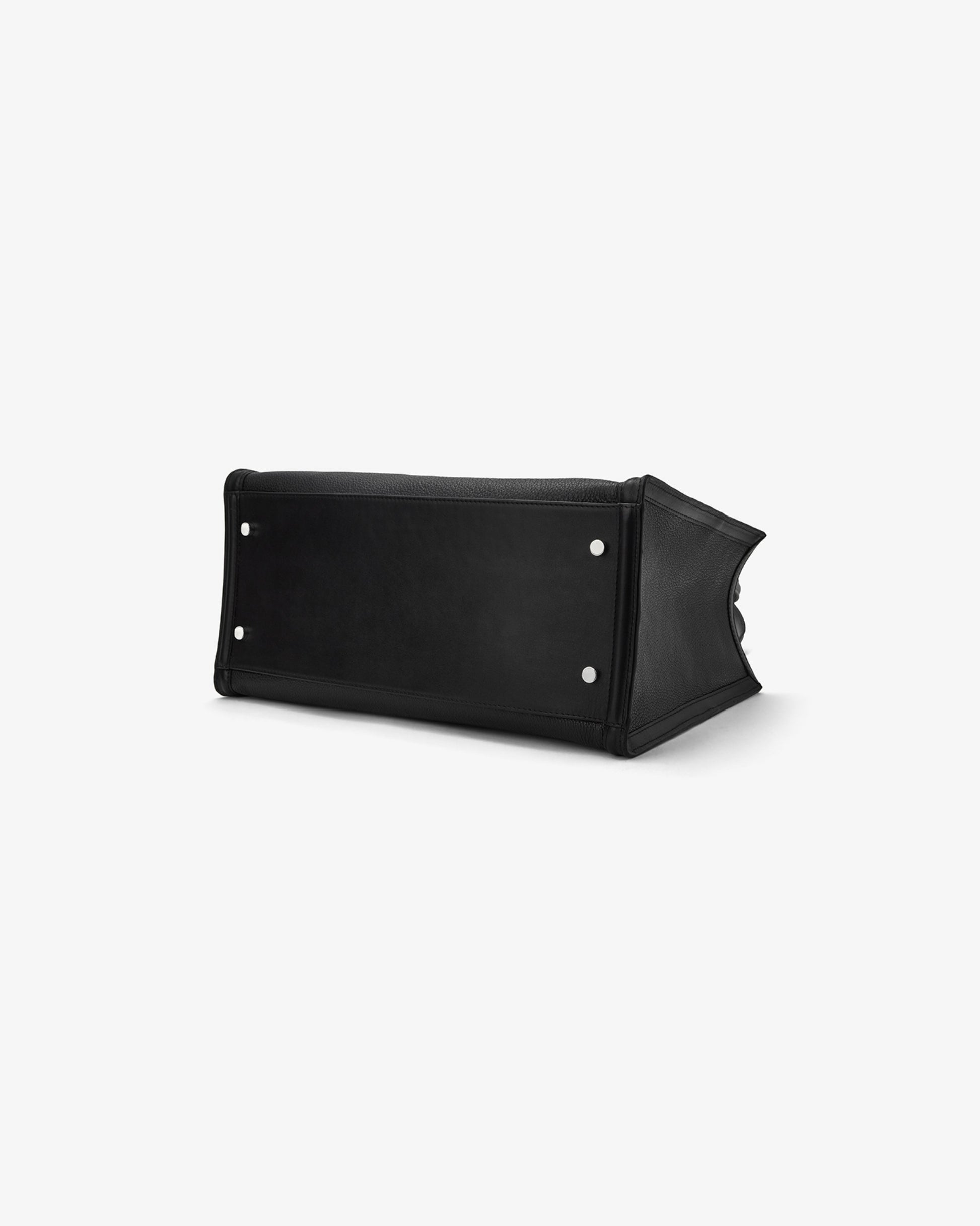 A black leather bag with silver-tone metal studs, shown from a side angle on a clean white background.