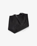 A black leather tote bag with double shoulder straps, shown from a three-quarters perspective on a clean white background.