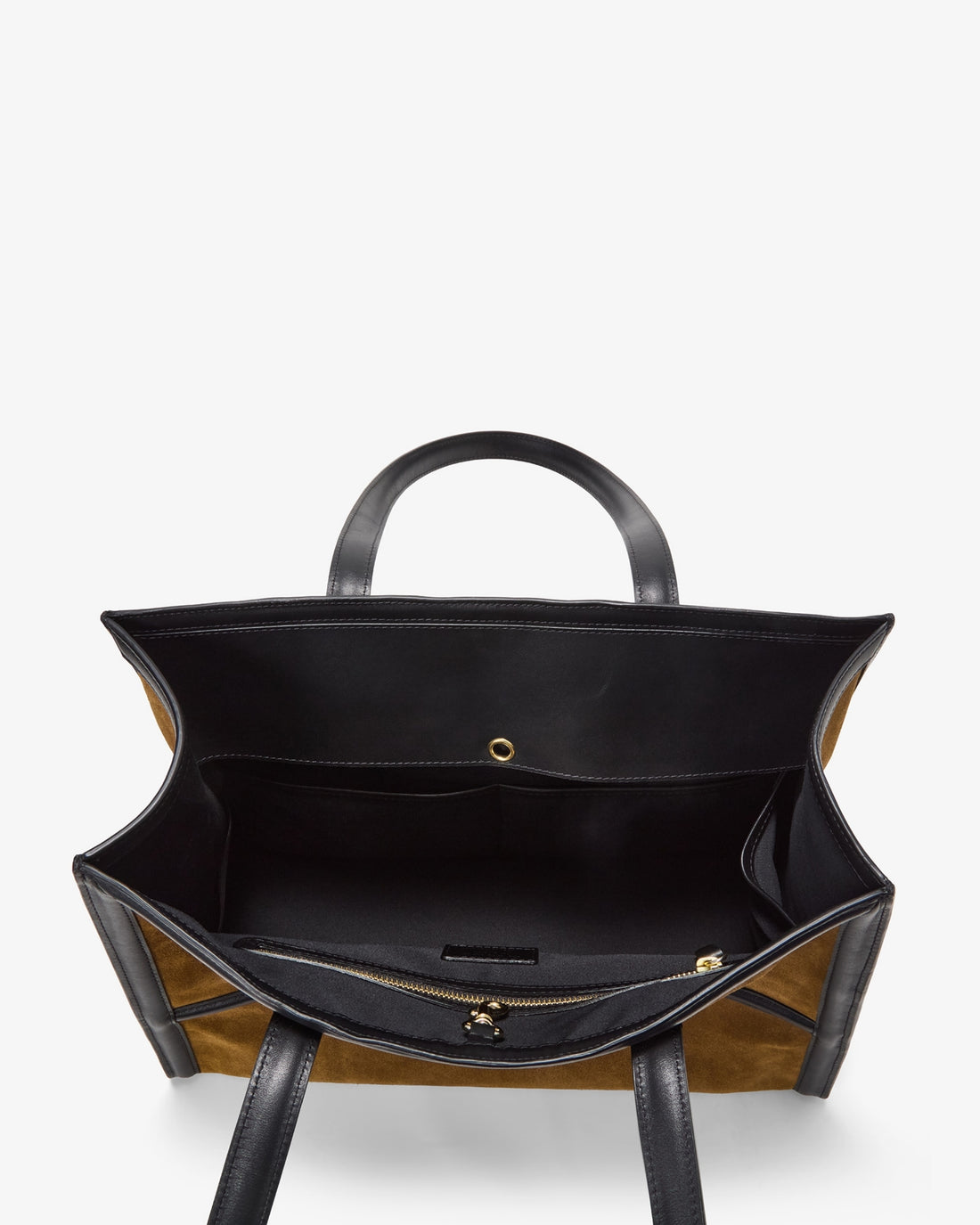 An overhead view of a structured tote bag with a black interior lining, black leather handles, and tan and black striped exterior panels, shown against a plain white background.