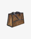 A structured tote bag made of brown suede with black leather trim and handles, shown on a plain light gray background.