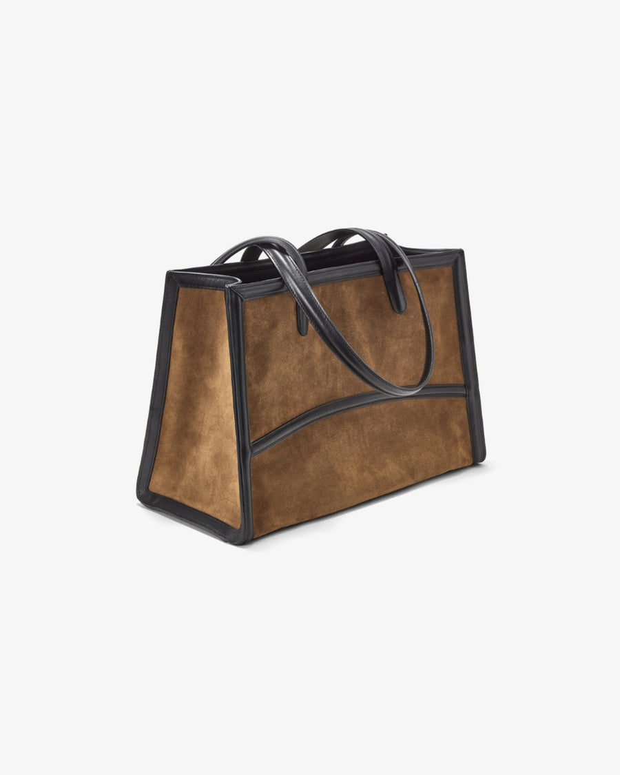 A structured tote bag made of brown suede with black leather trim and handles, shown on a plain light gray background.