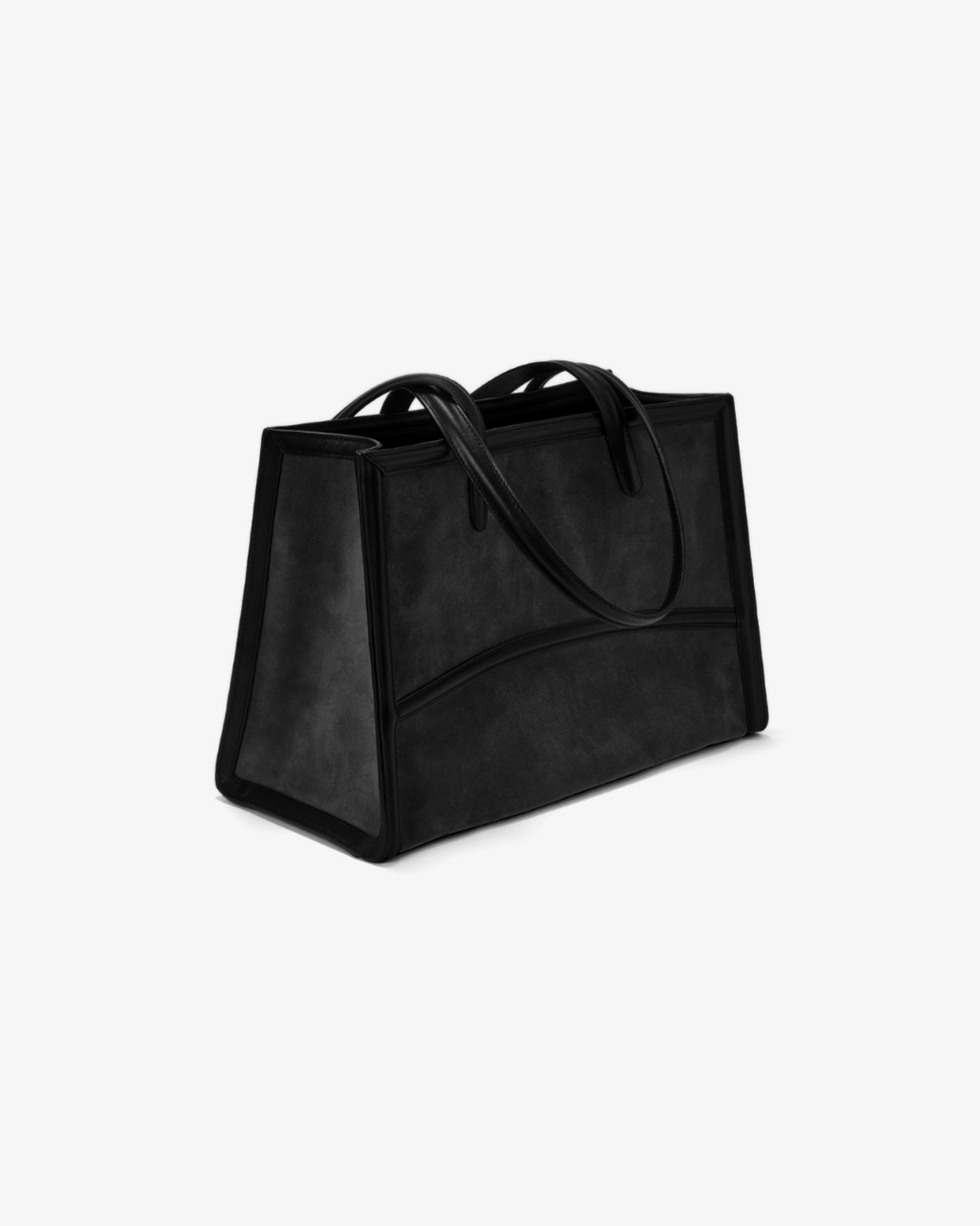 A black suede-like tote bag with black leather handles and trim, photographed on a clean white background.