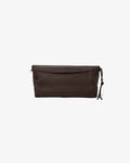 A dark brown leather clutch bag with a small tassel charm and gold-tone hardware, shown against a plain light gray background.