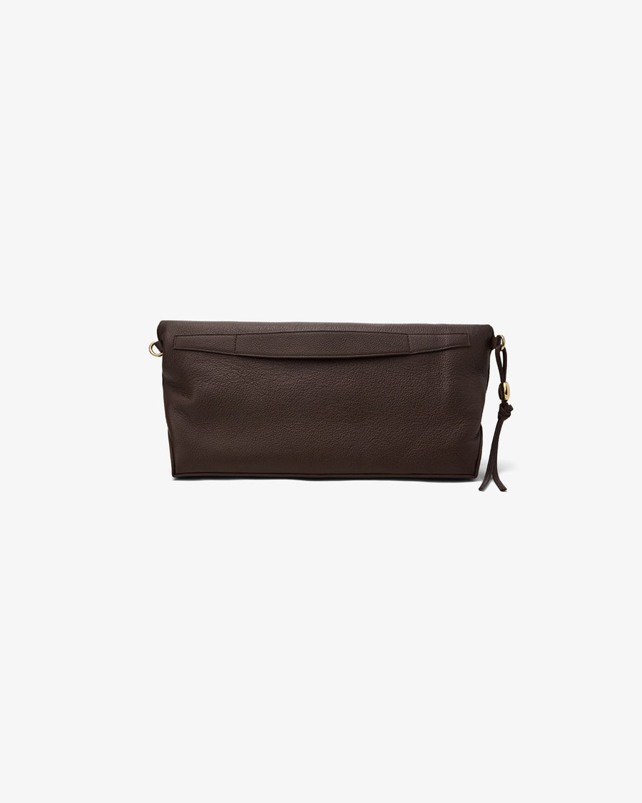 A dark brown leather clutch bag with a small tassel charm and gold-tone hardware, shown against a plain light gray background.