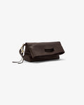 A dark brown leather clutch bag with a flap closure, a cutout detail on the front, and a small gold-tone zipper pull, shown on a plain light gray background.