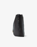 A black leather slouchy shoulder bag with gold-tone hardware, shown from a side profile view against a light gray background.