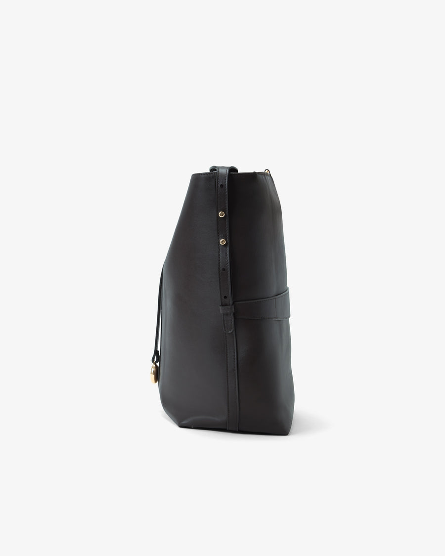 A black leather slouchy shoulder bag with gold-tone hardware, shown from a side profile view against a light gray background.