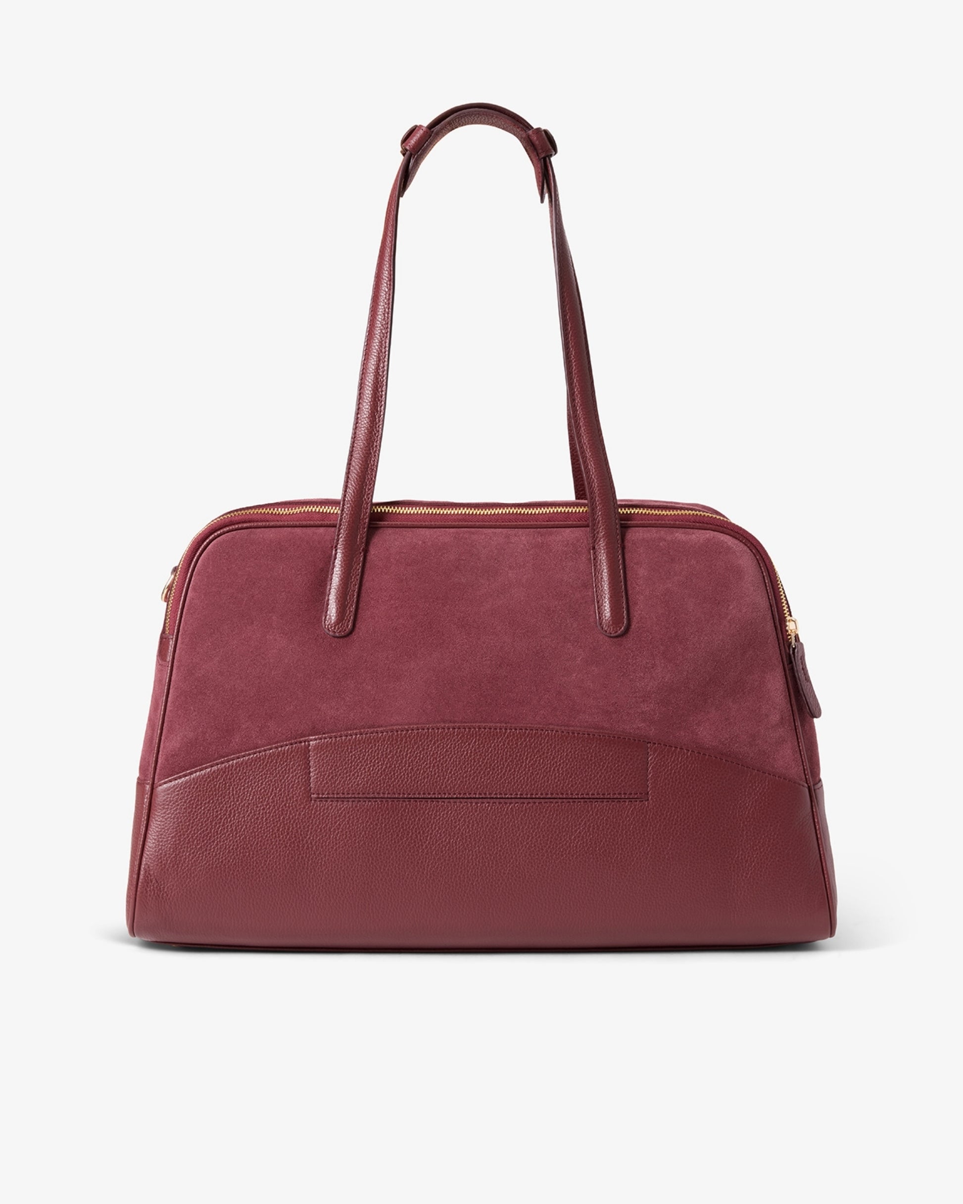 A burgundy leather and suede duffel bag with dual top handles and gold-tone hardware as well as a luggage strap, photographed against a clean white background.