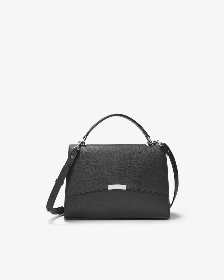 A black leather bag with a top handle, a detachable shoulder strap, and silver hardware, shown against a white background.