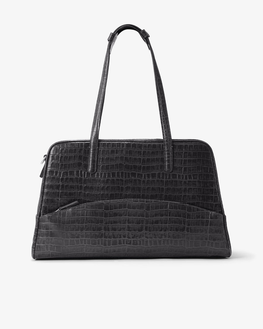 A black crocodile-embossed leather tote bag with dual top handles, shown against a plain light gray background.