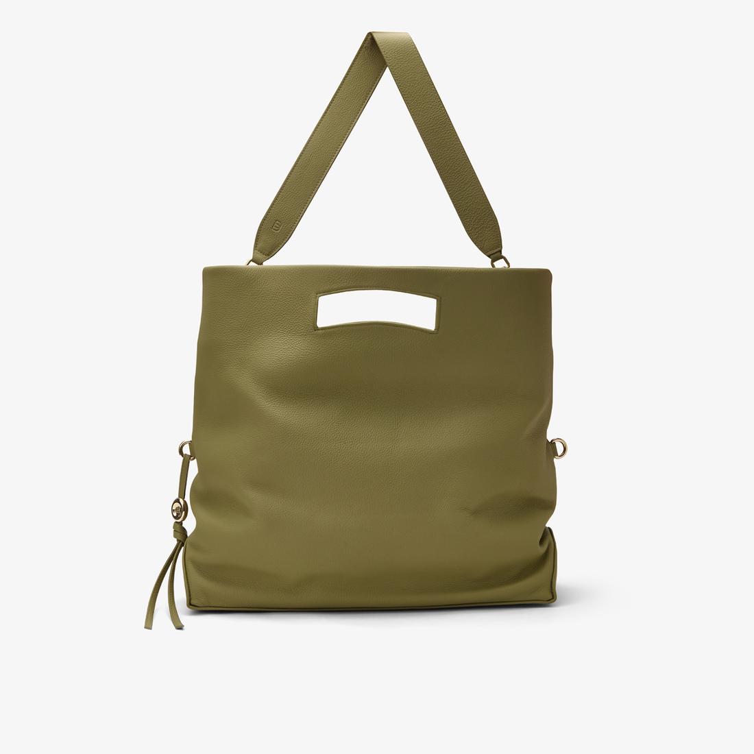 Foldable Soft Tote in Pistachio/Gold with a wide leather shoulder strap attached, showing its adaptability for both hand-carry and shoulder wear.