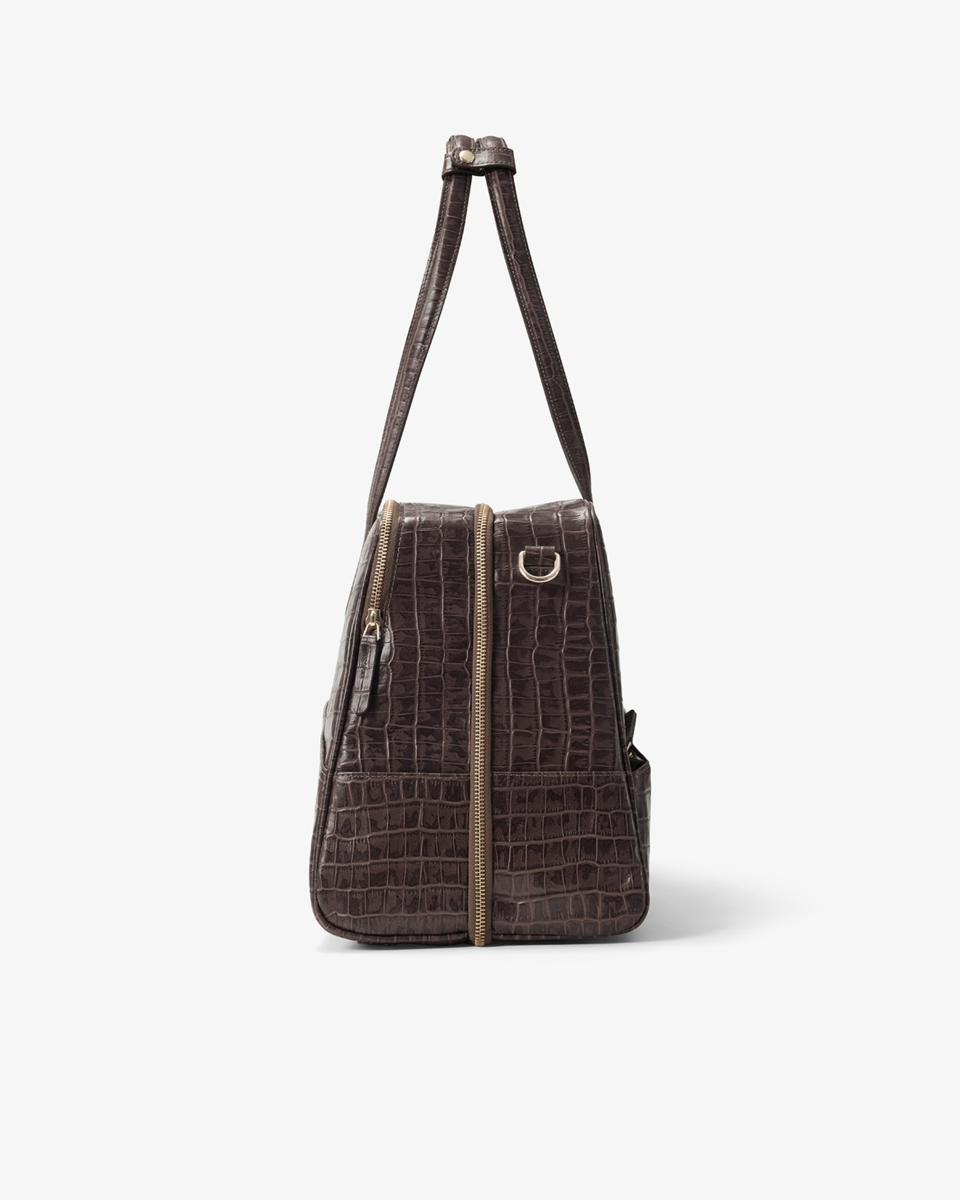A dark brown crocodile-embossed leather shoulder bag with gold-tone hardware, shown from the side against a plain light gray background.
