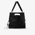 Upright view of the Foldable Soft Tote in Black/Silver, fully extended, highlighting its spacious design, integrated shoulder strap, and soft pebbled leather.