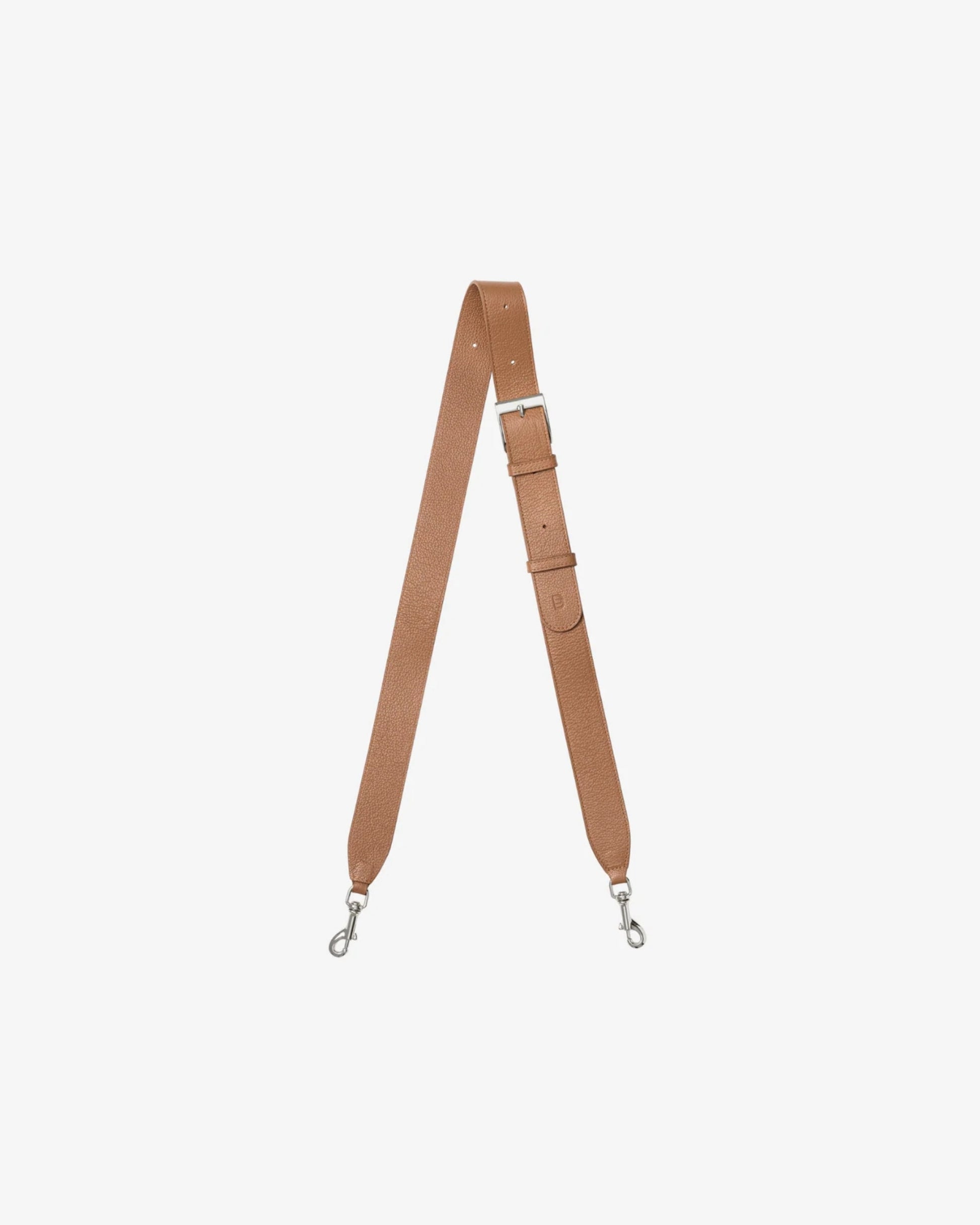 A tan leather shoulder strap with silver metal swivel clips on both ends, displayed vertically against a solid off-white background.