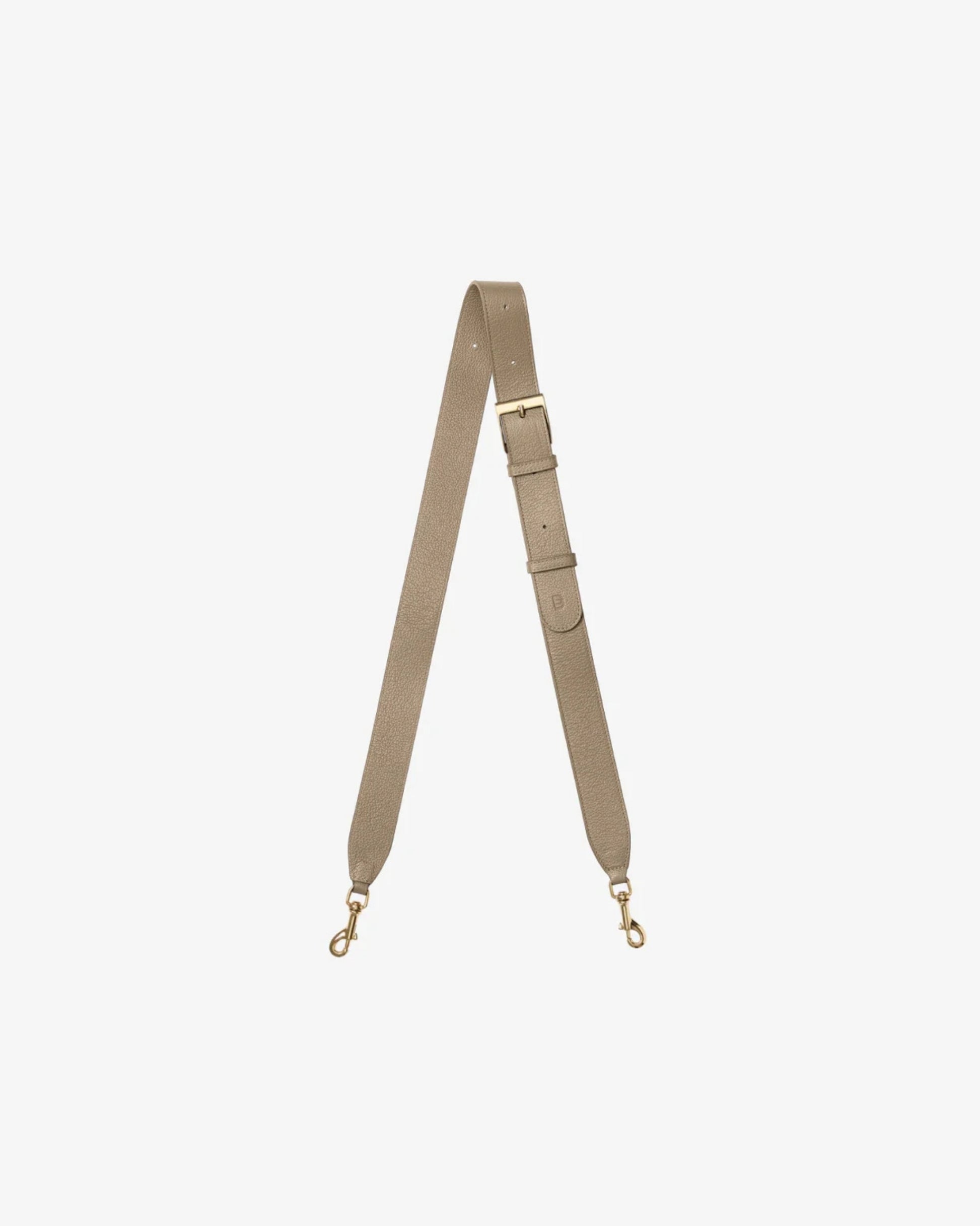 A taupe leather shoulder strap with gold-tone metal hardware, including a buckle, adjustment loops, and two swivel snap hooks, displayed on a light gray background.