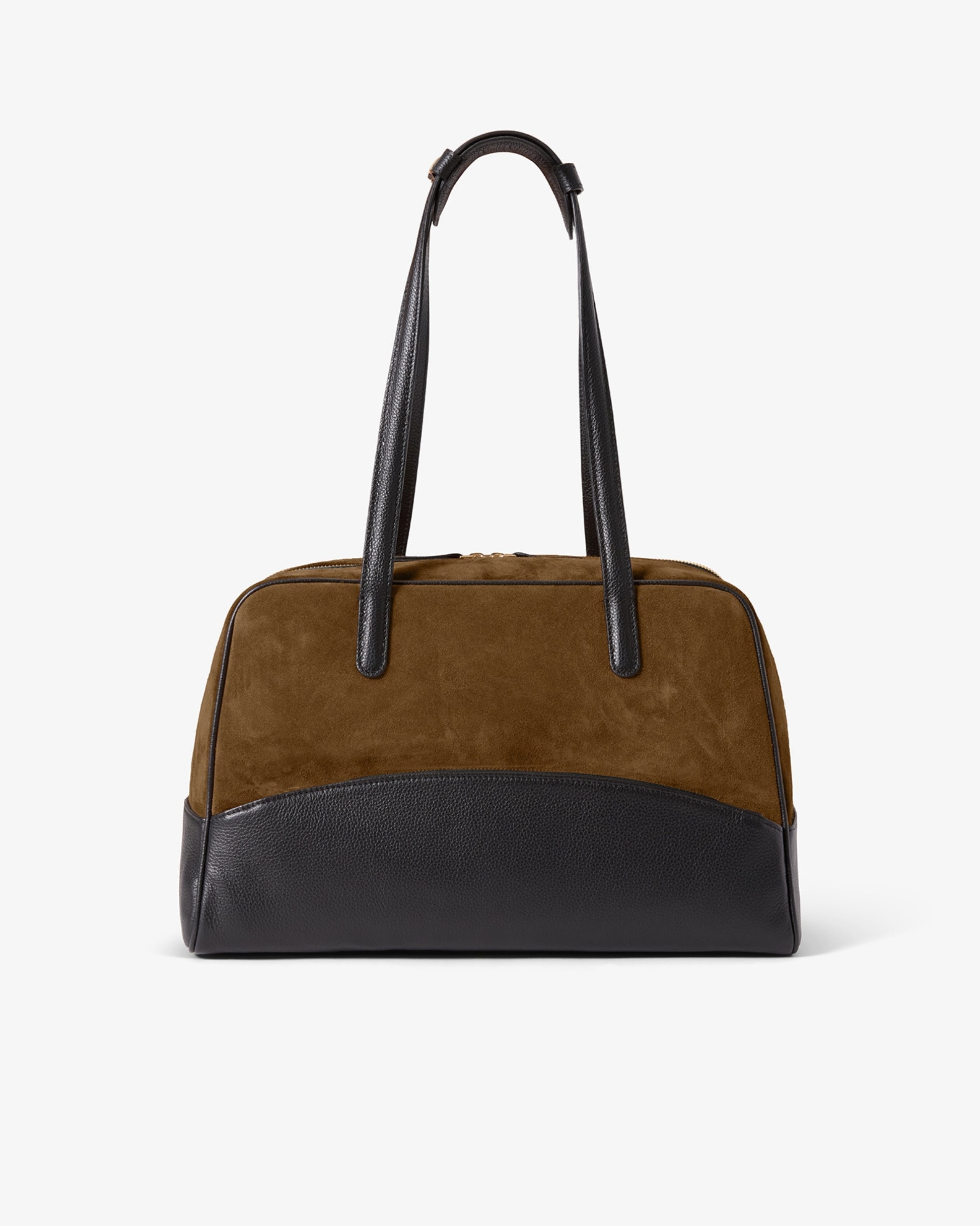 A color-blocked duffel bag featuring a brown suede upper body, a black leather lower base, and black leather shoulder straps, shown against a plain white background.