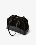 A structured black leather bag with dual top handles and a top zipper closure, photographed on a clean white background.